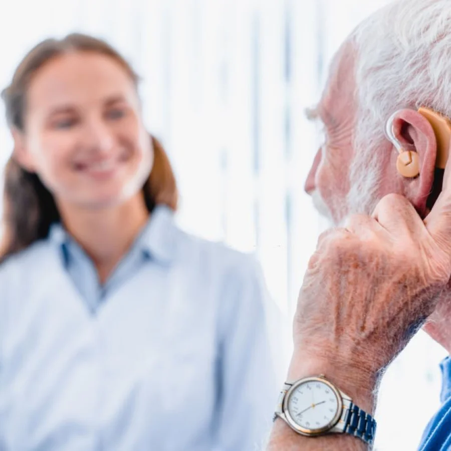hearing-aids on elderly man