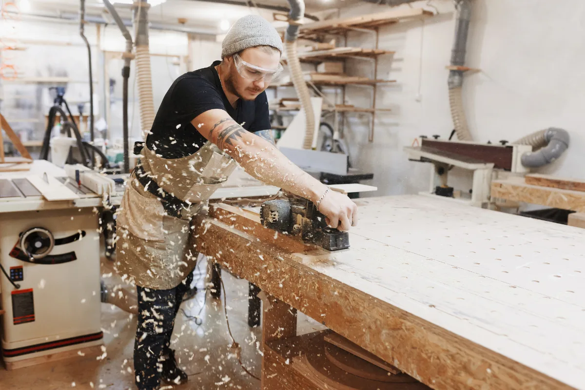 HASSA carpenter working with sanding machine