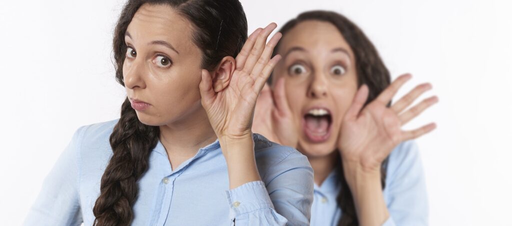 woman cannot hear and has hand to ear
