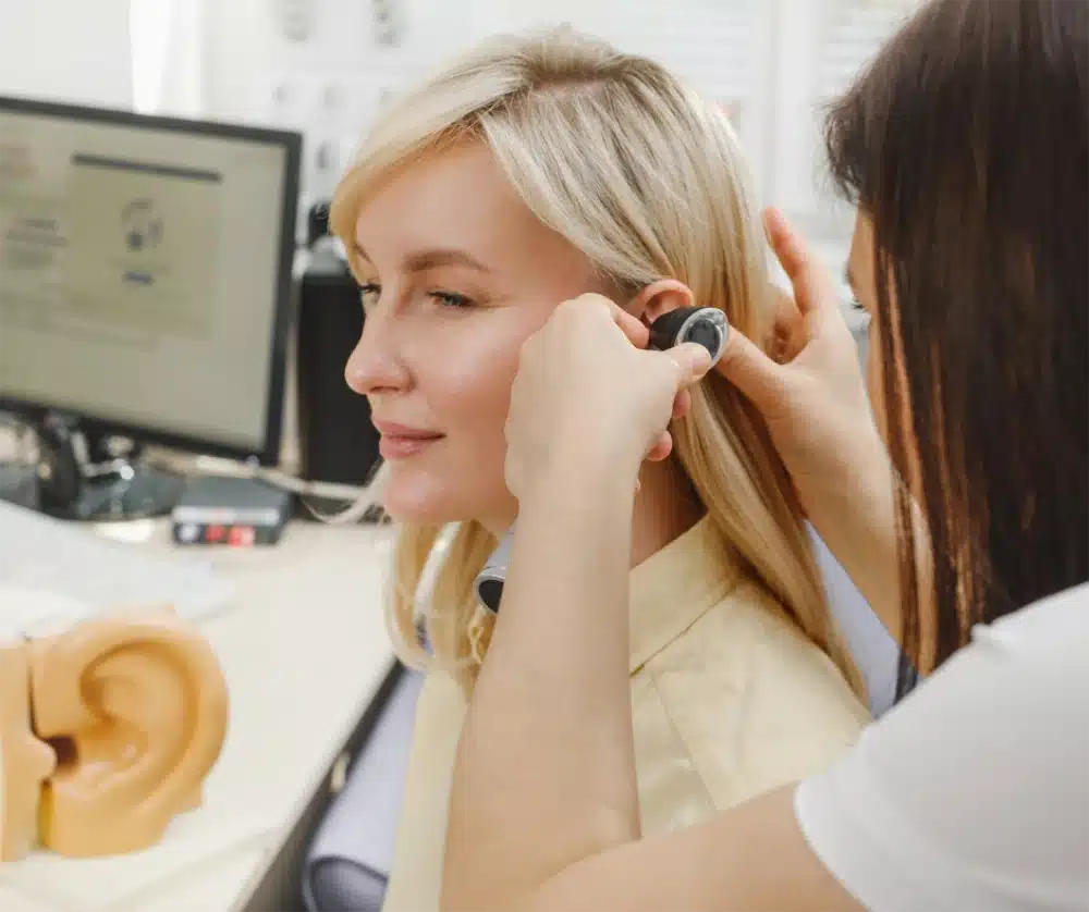 HASSA audiologist with patient