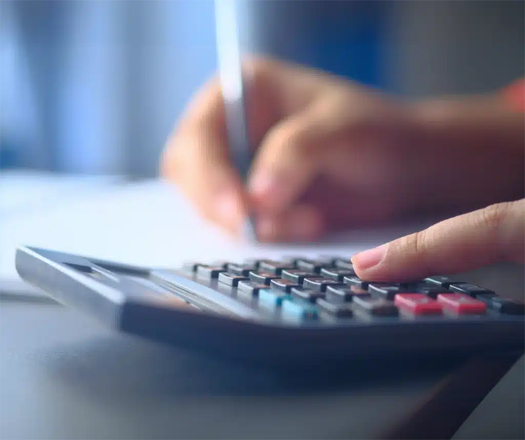 Man using calculator-Know About Hearing Aid Funding in Australia Man using calculator-Know About Hearing Aid Funding in Australia