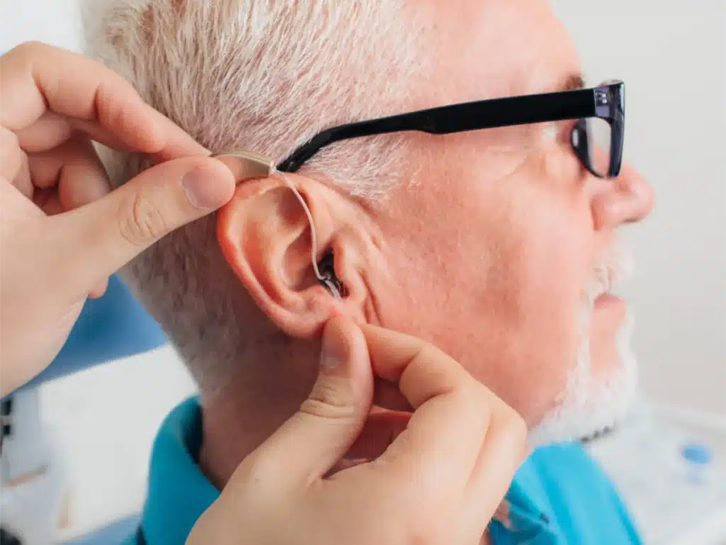 Man getting Hearing Aids fitted for Better Hearing this Christmas Man getting Hearing Aids fitted for Better Hearing this Christmas