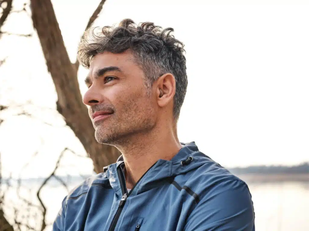 Man with Invisible Hearing Aids Man with Invisible Hearing Aids