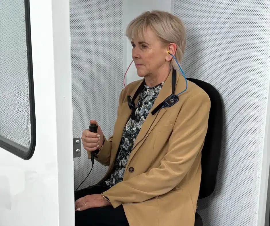 Do I need a hearing test-woman in hearing booth Do I need a hearing test-woman in hearing booth